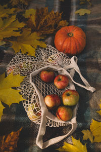 High angle view of fruits in basket on table