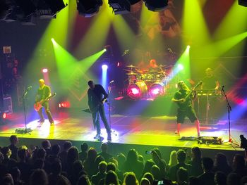 People enjoying music concert at night