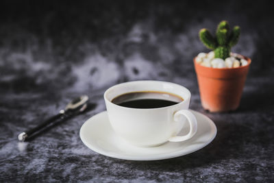 Close-up of coffee cup on table