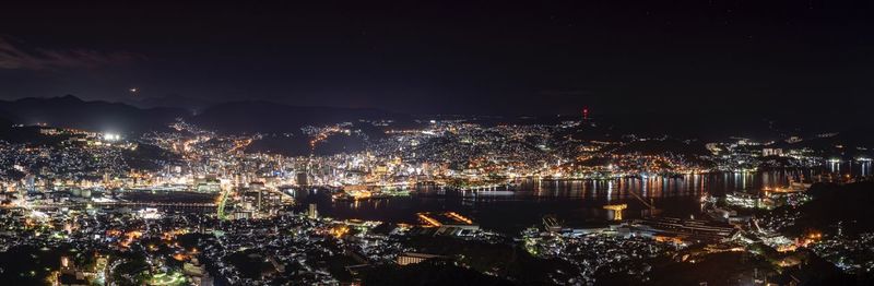 High angle view of illuminated buildings in city at night