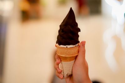 Hand holding ice cream cone