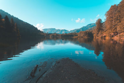 Scenic view of lake against blue sky