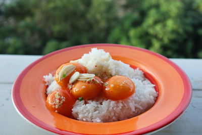 Close-up of served fruits in plate on table