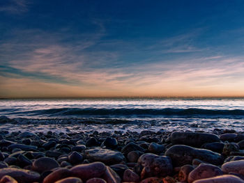 Scenic view of sea against sky during sunset