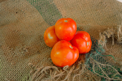 Close-up of tomatoes on sack