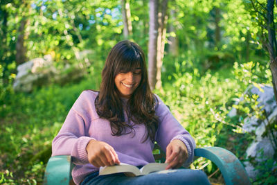 Portrait of a smiling young man sitting outdoors