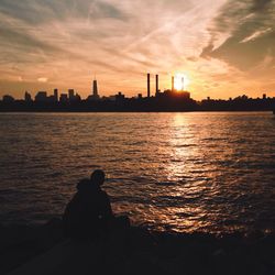 Silhouette of city at sunset