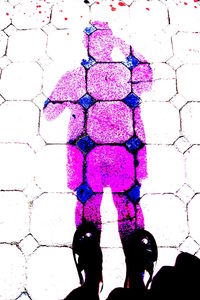 Close-up of woman in pink background