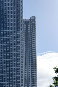 Low angle view of buildings against sky in city