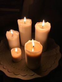 Close-up of illuminated tea light candles
