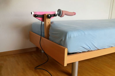 High angle view of camera on table against wall at home