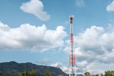 Low angle view of communications tower against sky