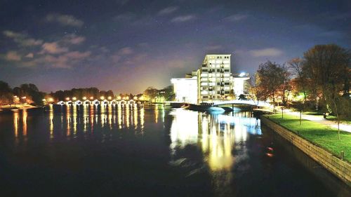 Reflection of illuminated buildings in water at night