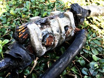 Close-up of rusty abandoned on field