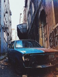 Abandoned car in city