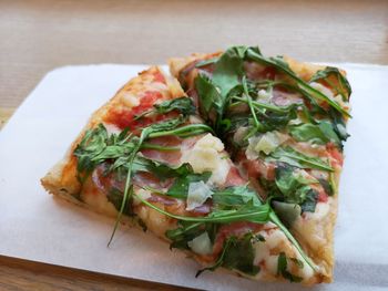 Close-up of pizza served on table