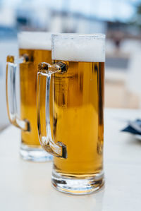 Close-up of beer glass on table