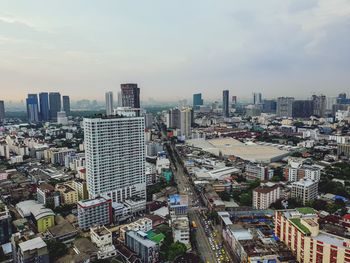 High angle view of city buildings against sky
