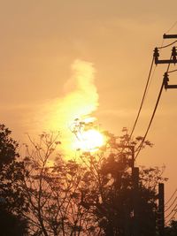 Low angle view of silhouette trees against sky during sunset