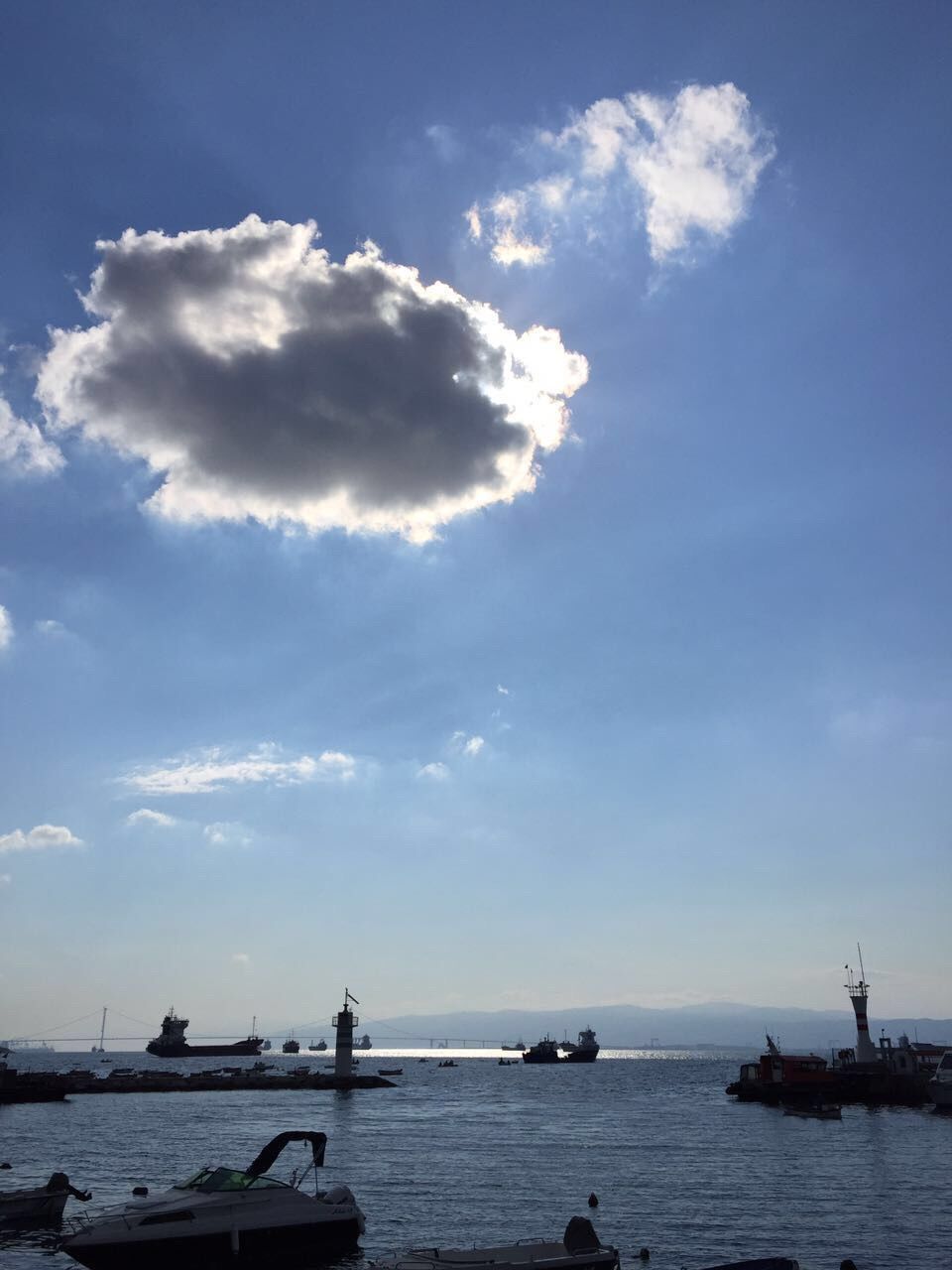 BOATS MOORED IN SEA