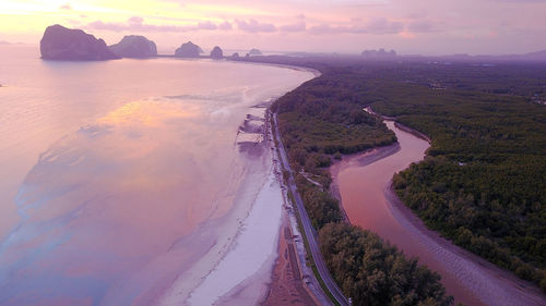 High angle view of sea shore against sky during sunset