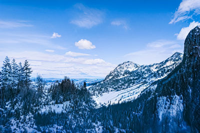 Scenic view of snowcapped mountains against sky