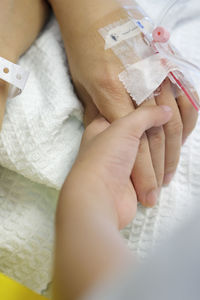 Close-up of woman holding hands