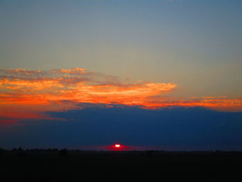 Scenic view of silhouette landscape against sky during sunset