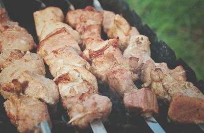 Close-up of meat on barbecue grill