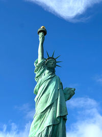 Low angle view of statue against sky