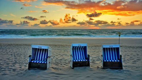 Scenic view of beach at sunset