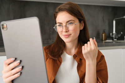 Young woman using mobile phone