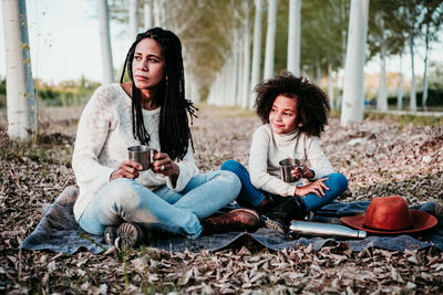 Young woman sitting outdoors