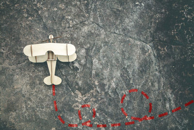 Directly above shot of heart shape on white wall