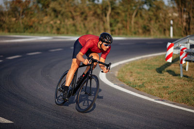 Man riding bicycle on road