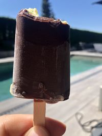 Close-up of hand holding ice cream