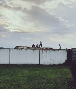 People on field against sky