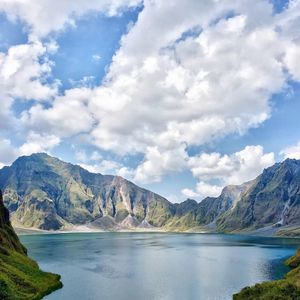 Scenic view of lake and mountains against sky