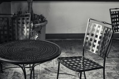 Close-up of empty chairs and table at home