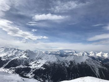 Scenic view of snowcapped mountains against sky