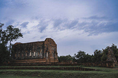 Old ruin building against cloudy sky