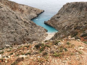 High angle view of rocks by sea