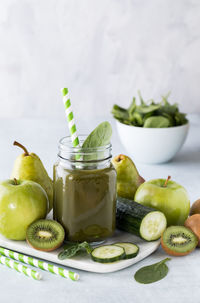 Glass jar of green smoothie.