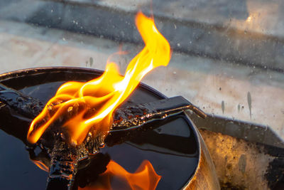 Close-up of burning fire on water
