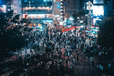 High angle view of crowd on city street at night