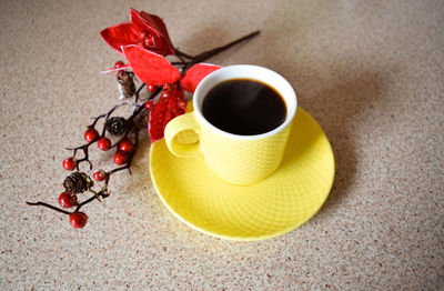 Close-up of fruit and black coffee