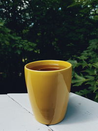Close-up of coffee cup on table
