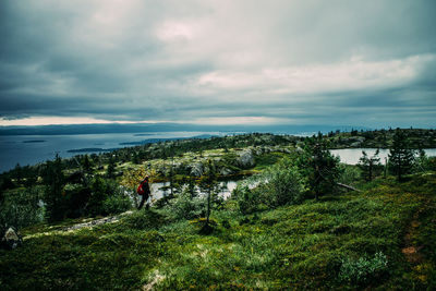 Scenic view of sea against cloudy sky