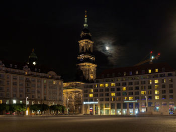 Illuminated buildings in city at night