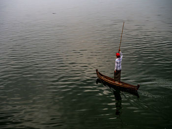 Man in boat on sea